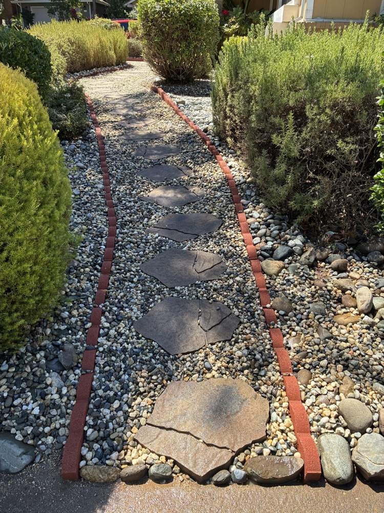 Flagstone stepping-stone path with brick edging